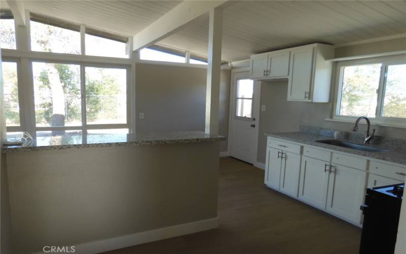 Kitchen other view.  Door to the right goes to the back yard