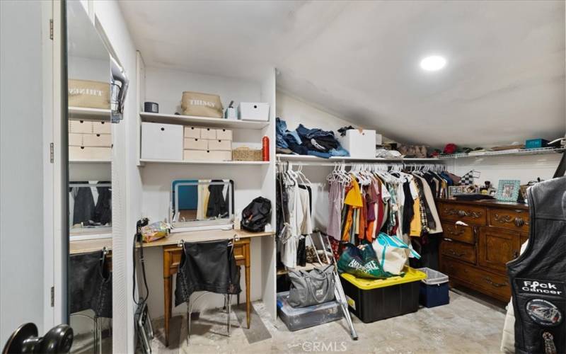 walk in closet in primary bedroom