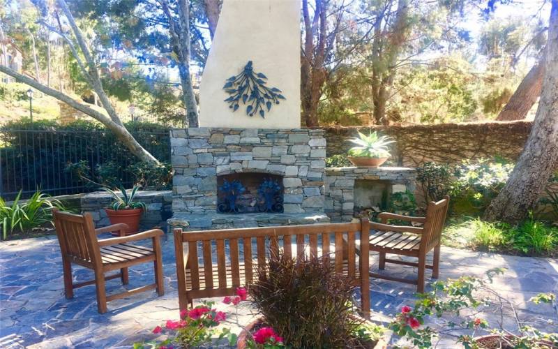 Fire place and sitting area by pool and spa