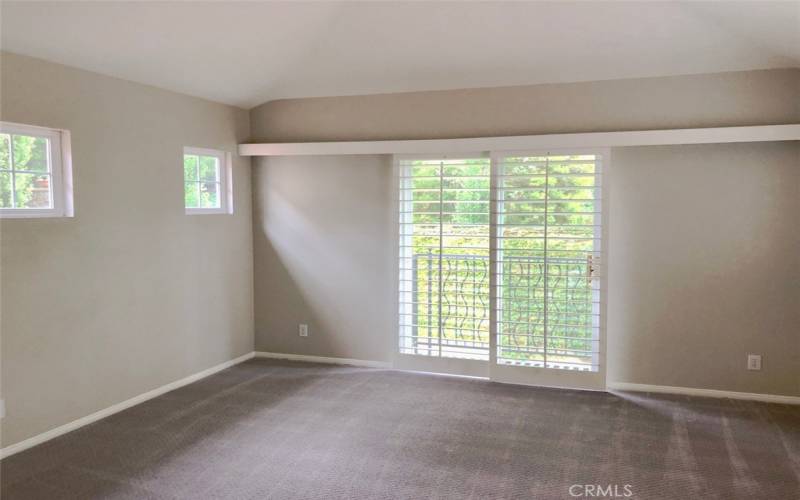 Master bedroom. Lots of windows and recently painted white.