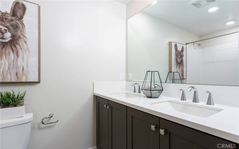 Shared second floor bathroom with shower/tub combination.