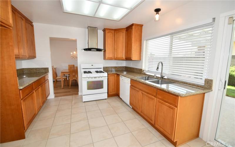 Remodeled ktichen with formal dining area through doorway.