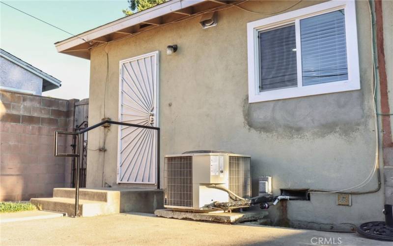 Rear view from backyard, AC unit by the door.