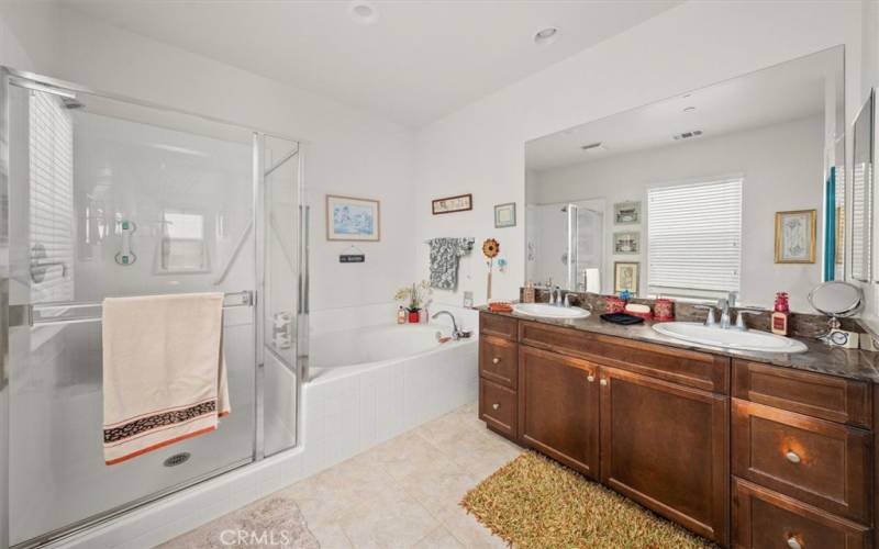 Master Bathroom with walk-in shower & separated bath tub.