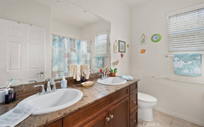 Hall Bath with upgraded counter-top, double sinks, Moen Faucets, Plus tub -shower combo.