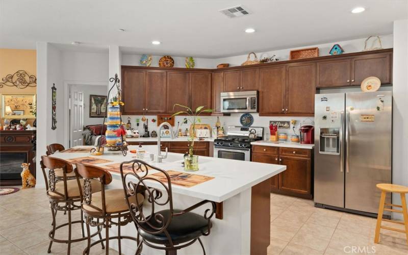 Large Kitchen Island stainless steel appliances & recessed lighting