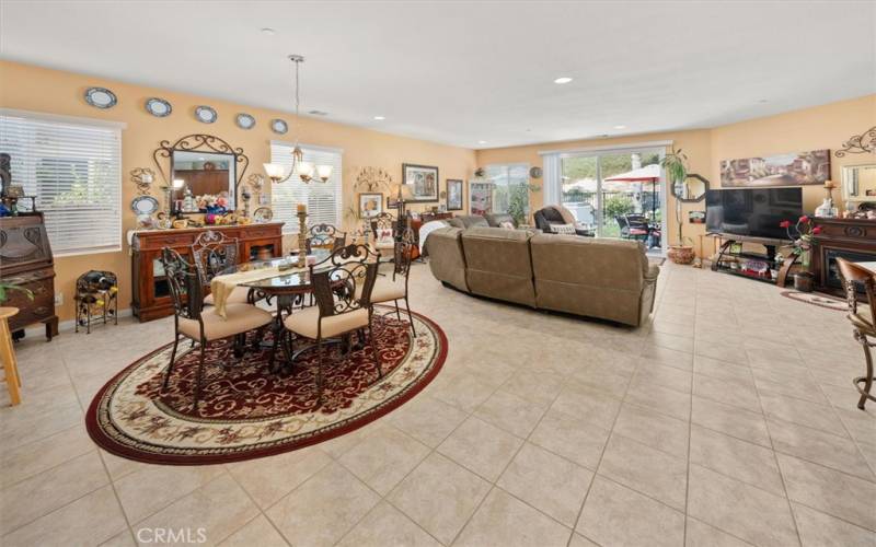 Open Floor Plan with lots of natural light & upgraded tiled flooring