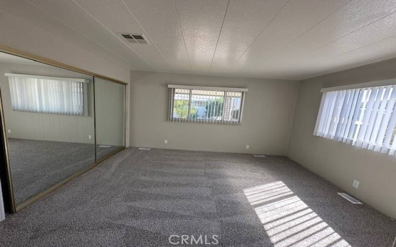 Master bedroom with two closets.