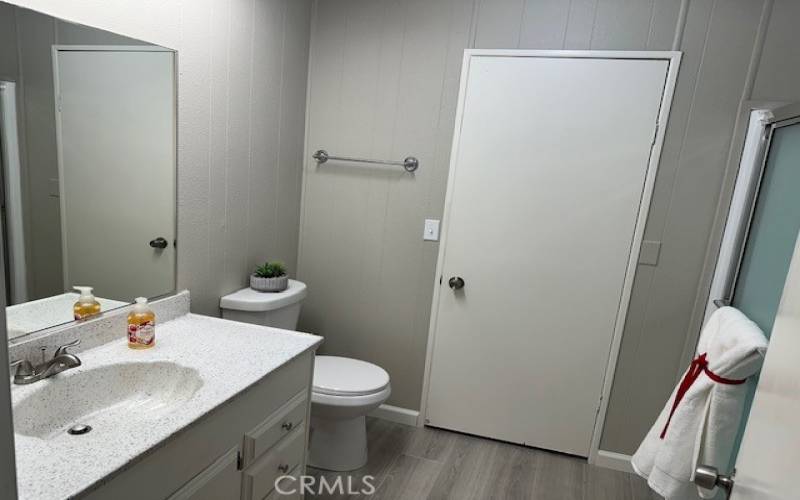 /guest bathroom with walk in shower.