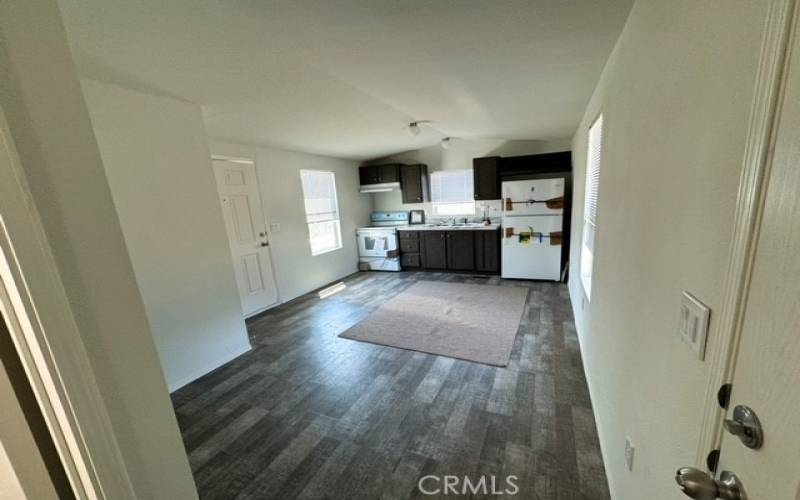 View of kitchen, dining and living area.