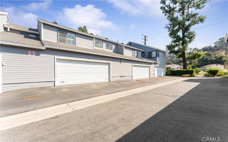 Oversized two car garage has cabinets and laundry area.