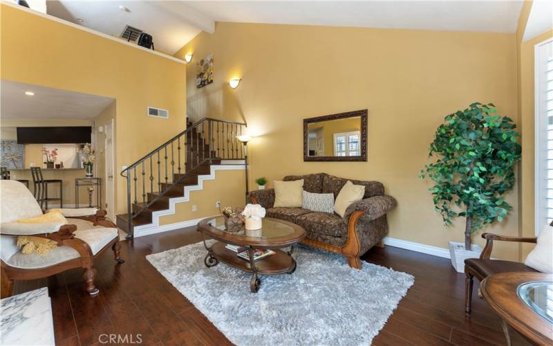 High two story angled ceiling exposes to the open loft above. Updated banisters and balusters.
