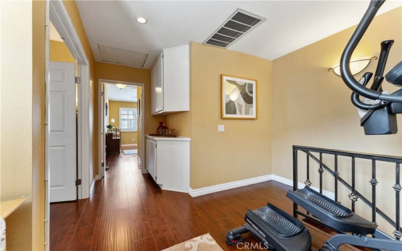 Immediate left from loft are the double door entry to the primary bedroom. Straight ahead is the second bedroom with private bath.