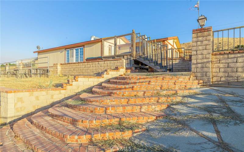 View from lower leverl towards house and patio/spa