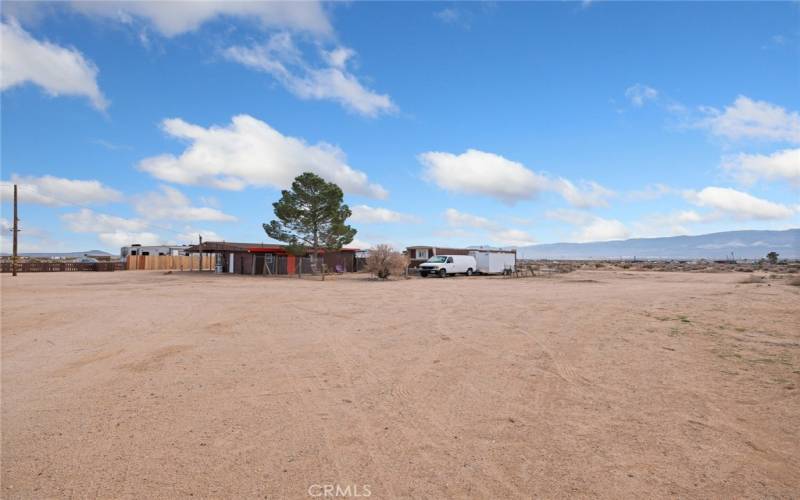 lot view with home in. background