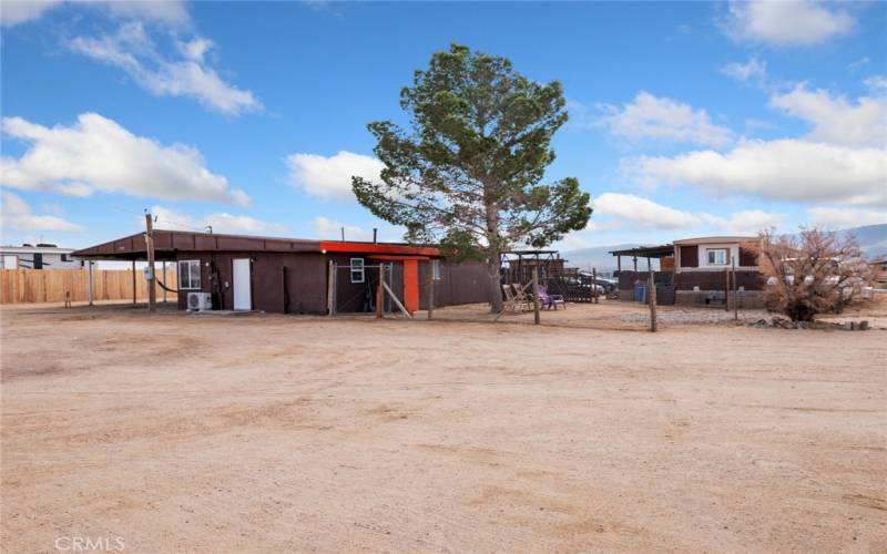 2nd lot view with home and carport