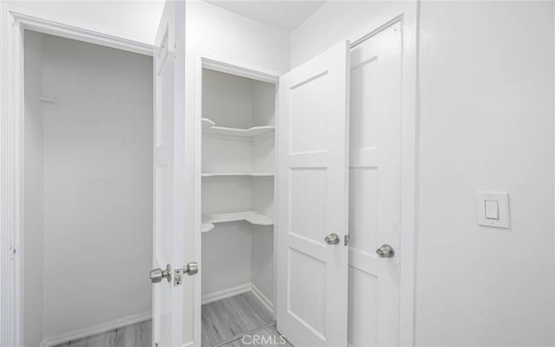 LOTS OF PANTRY SPACE IN LAUNDRY AREA.