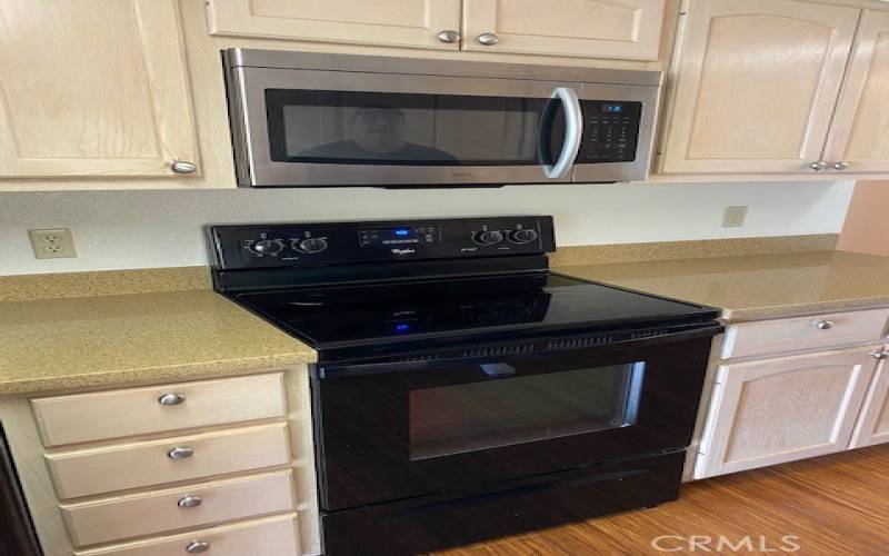 Electric range with microhood