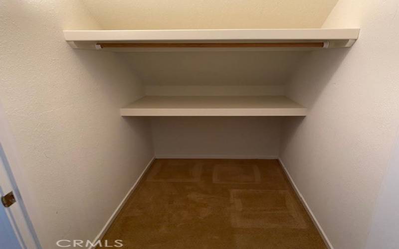 Storage space under stairs convenient to kitchen