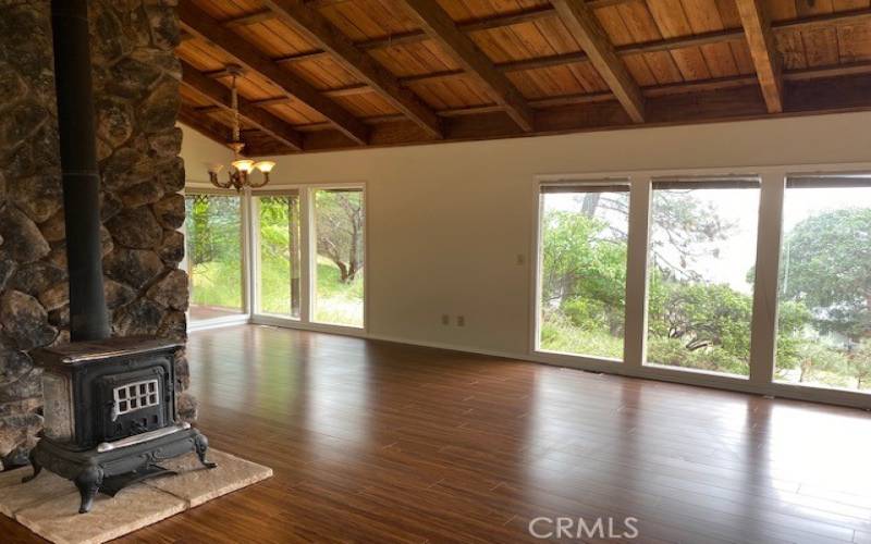 Living room/dining area area with gorgeous ceiling detail and huge windows