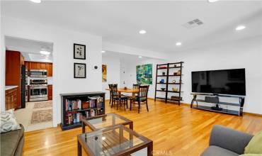 Open floor plan with hardwood flooring.