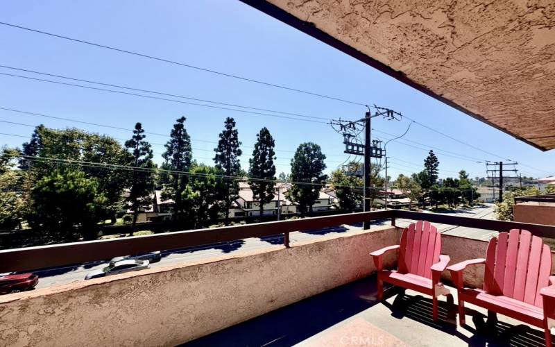 Great room balcony facing treelined street