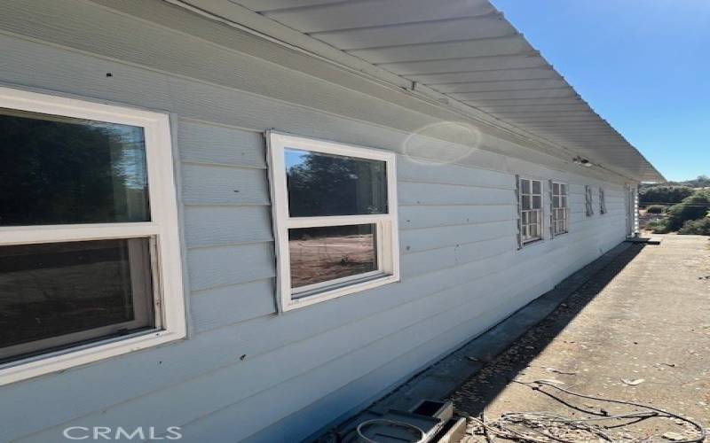 BACK SIDE OF HOME WITH CEMENT SLAB