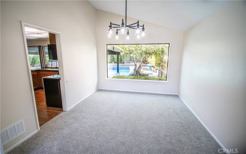 Formal dining room off of the kitchen and overlooking the pool