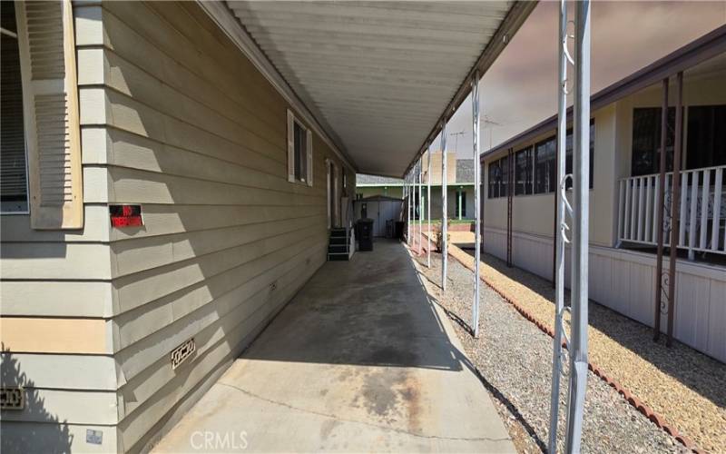 Driveway on right side.  Shed at the end.