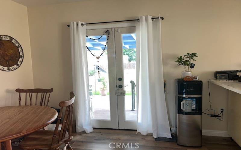 Dining - French doors leading to spacious backyard