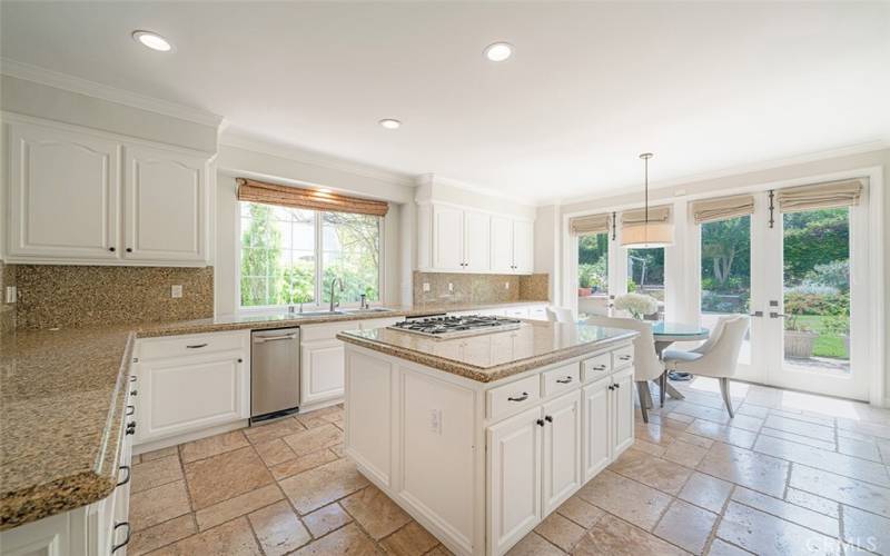 Kitchen with island and cooktop