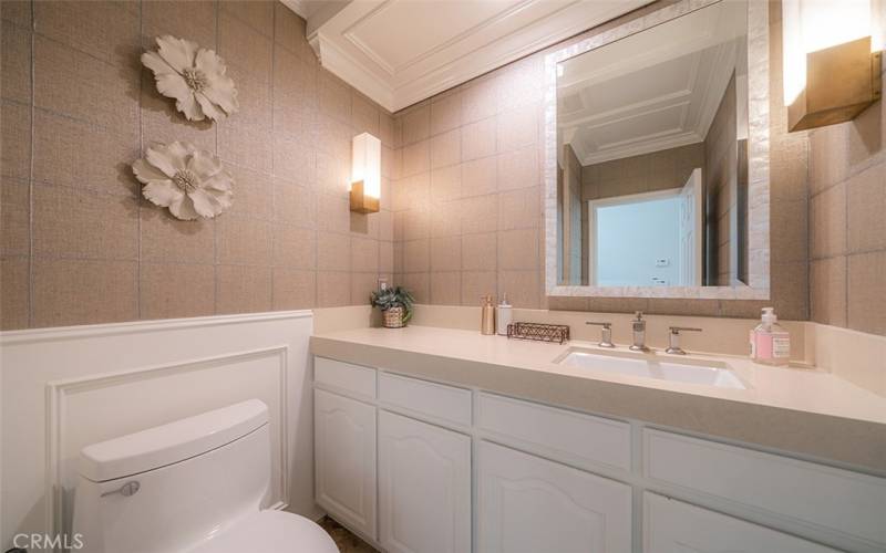 Main floor powder room near family room and kitchen