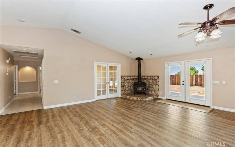 All secondary bedrooms and the laundry room are off to the left upon entering. The French doors lead to the room ideal for an office or craft room.