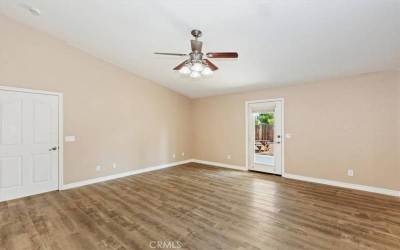 The primary bedroom also has a door to the backyard, ceiling fan and plenty of outlets. Have you ever had to move heavy furniture trying to find an outlet?