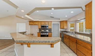 Note all the counter space along the front window area. The island also has high counter top if you want bar seating and a lower counter with sink for the prep area