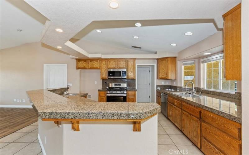 Note all the counter space along the front window area. The island also has high counter top if you want bar seating and a lower counter with sink for the prep area