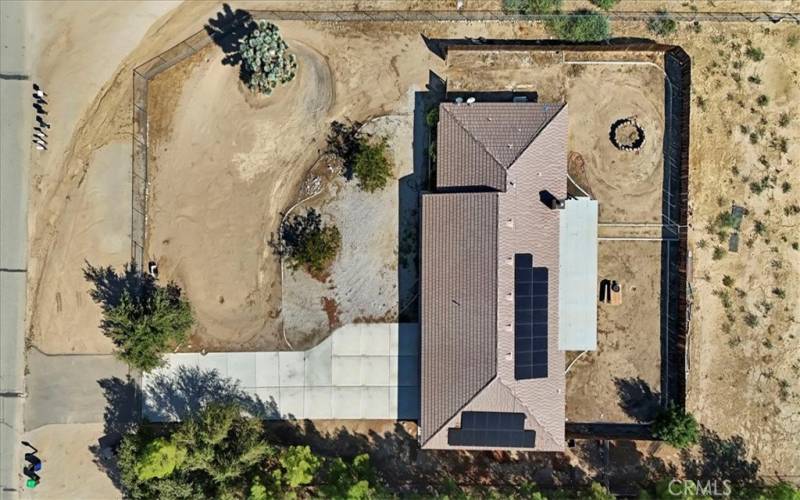 Arial view showing wood fence along backyard but property extends beyond to the chainlink fence.