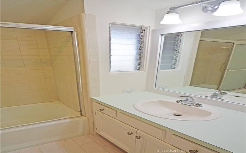 The primary bath features a shower over the tub.