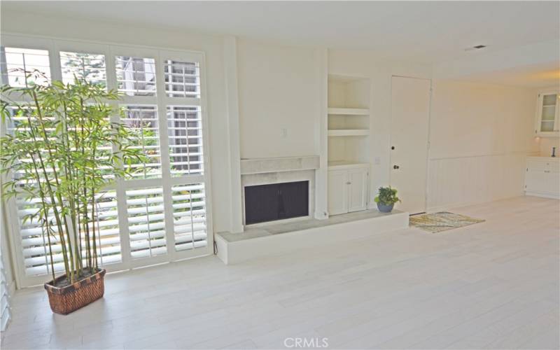 Custom top quality wood shutters grace the windows.