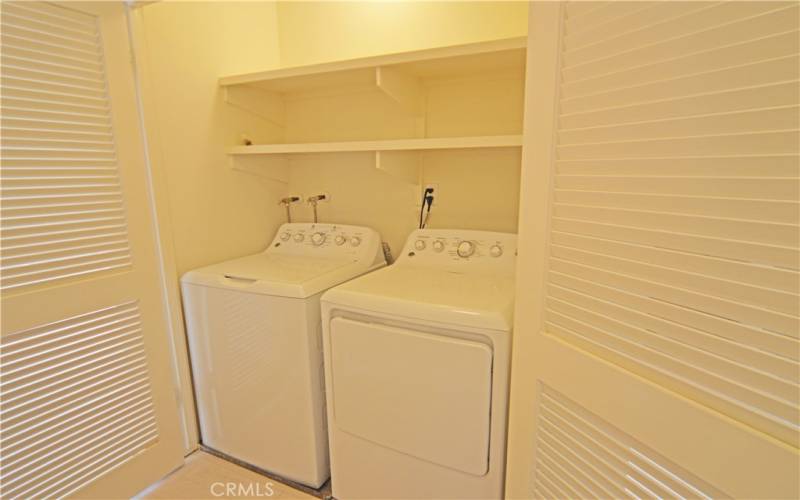 The washer and the dryer are located between the two upstairs bedrooms.