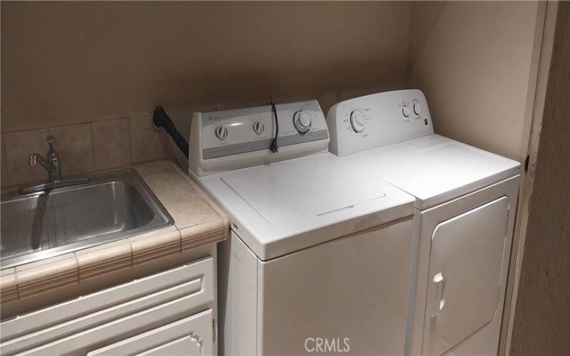 laundry room off kitchen with direct garage access