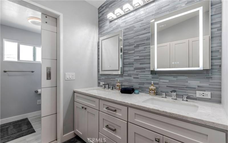 Primary Bathroom with New Granite Counter Tops, Mirrors, Light fixtures