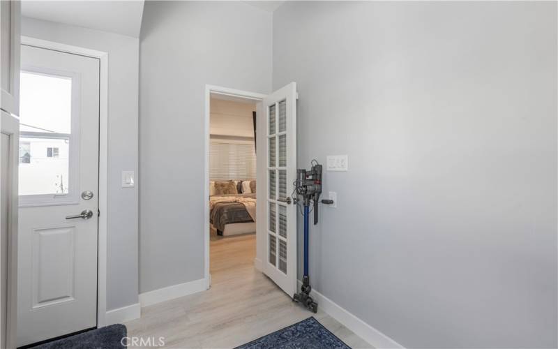 Laundry room with door to back yard