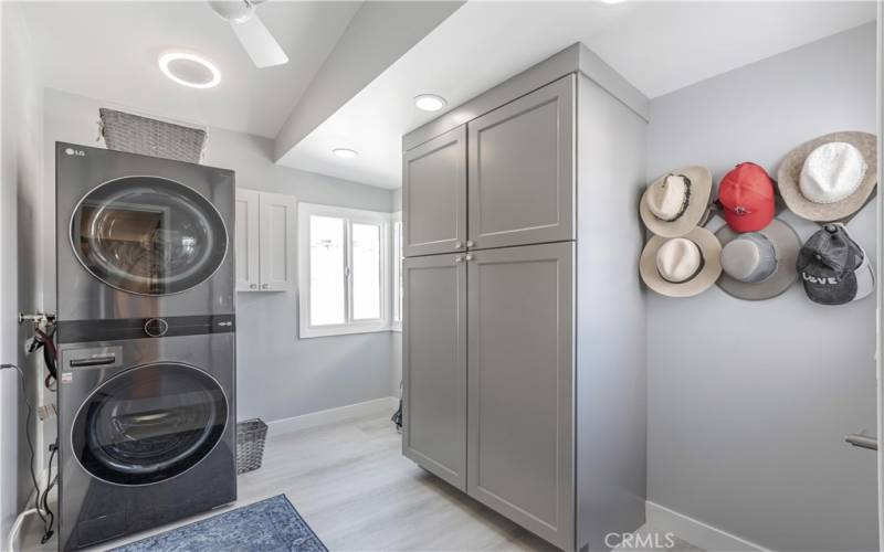 Laundry room within home with Storage Unit