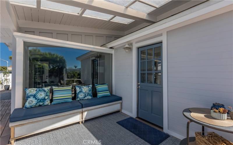 Large Window with views of patio and yard from Living room.