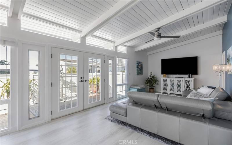 Living room with view a lovely French Doors and deck