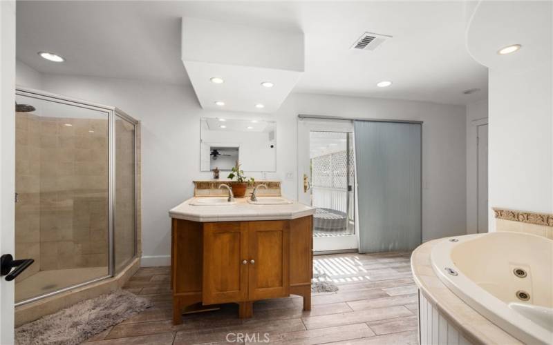 Separate shower and his hers sinks in the primary bathroom and large sliding doors to huge Deck!