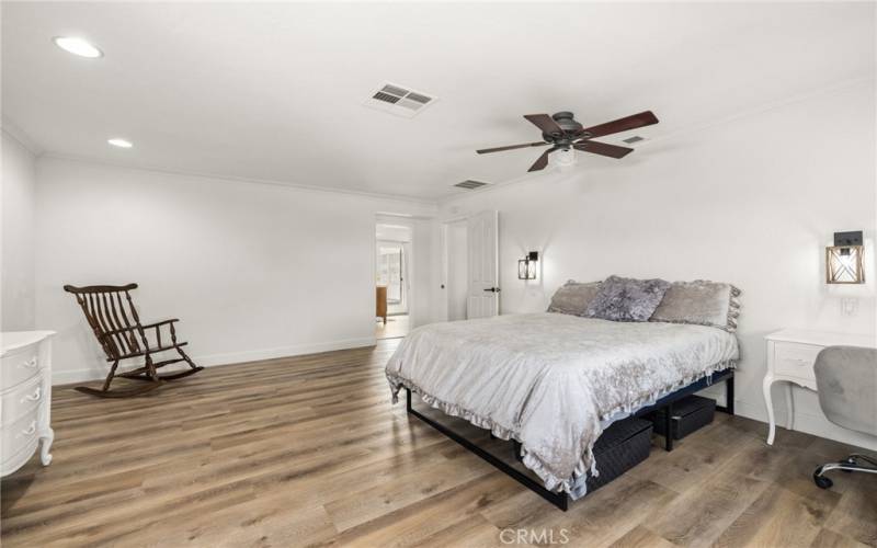 upstairs Primary bedroom and doorway to primary bathroom.