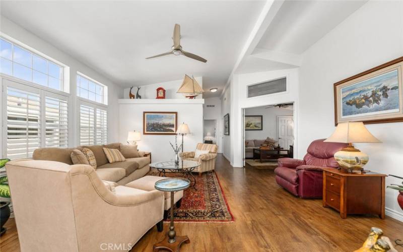 Living room offers very high ceilings and lots of windows that provide natural light