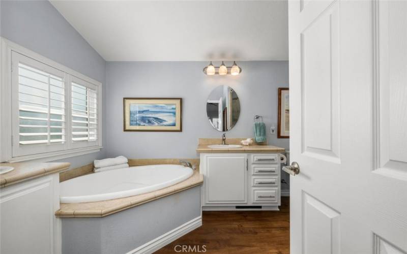 Master bath soaking tub with separate dual sinks.